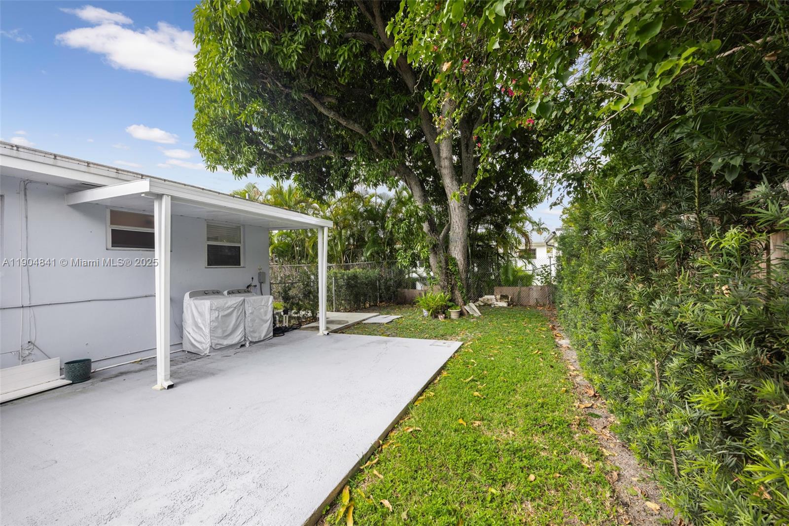 3101 Southwest 19th Street, Unit 3101 Miami, FL 33145 - Photo 13 of 15 a view of a house with backyard and patio