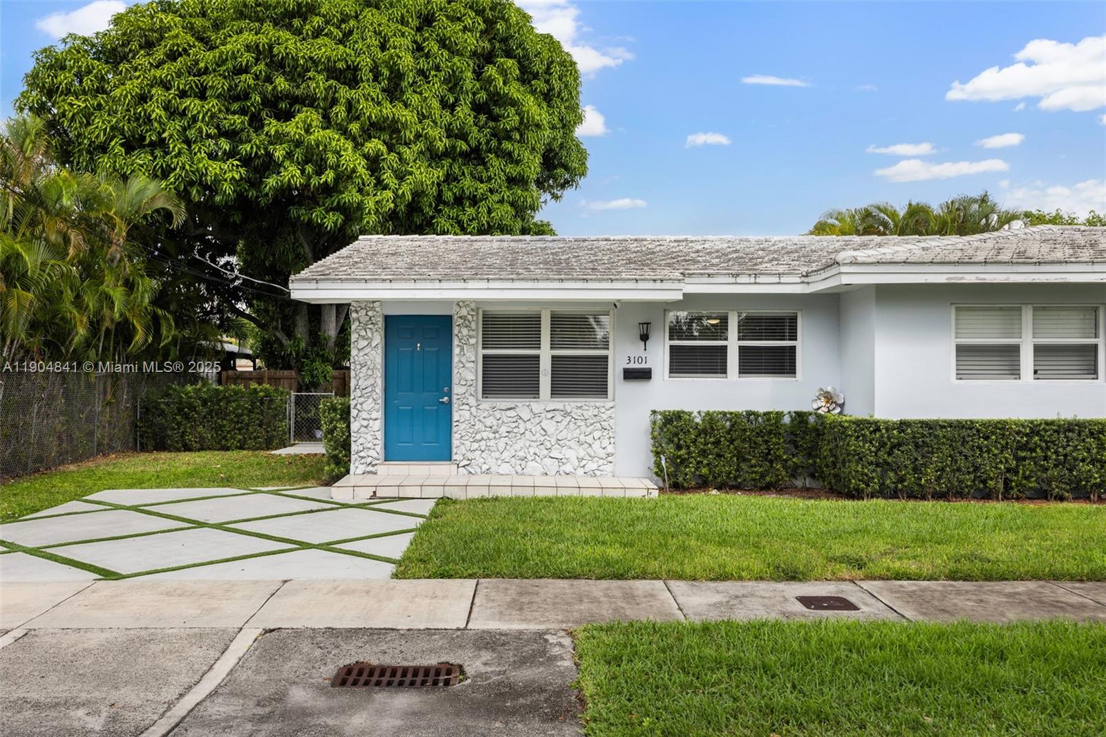 3101 Southwest 19th Street, Unit 3101 Miami, FL 33145 - Photo 15 of 15 a front view of a house with a yard and garage