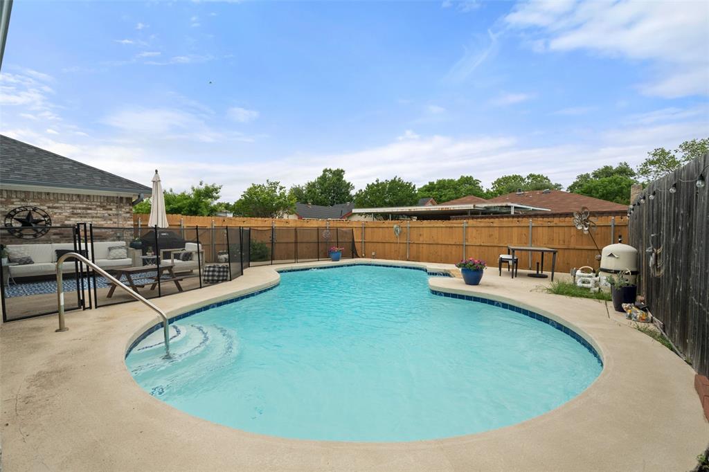 a view of a swimming pool with lounge chair