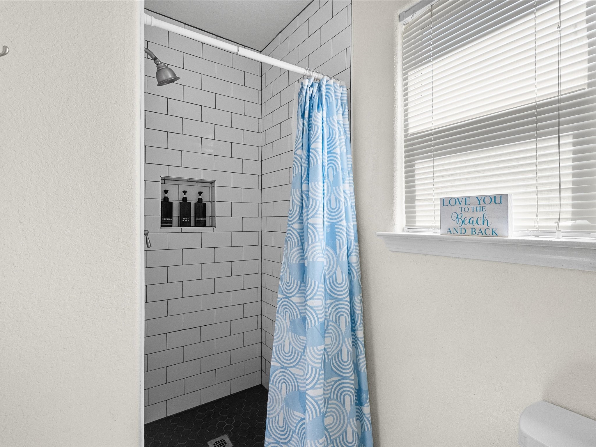 127 Howard Avenue Surfside Beach, TX 77541 - Photo 18 of 29 a bathroom with a shower and a sink