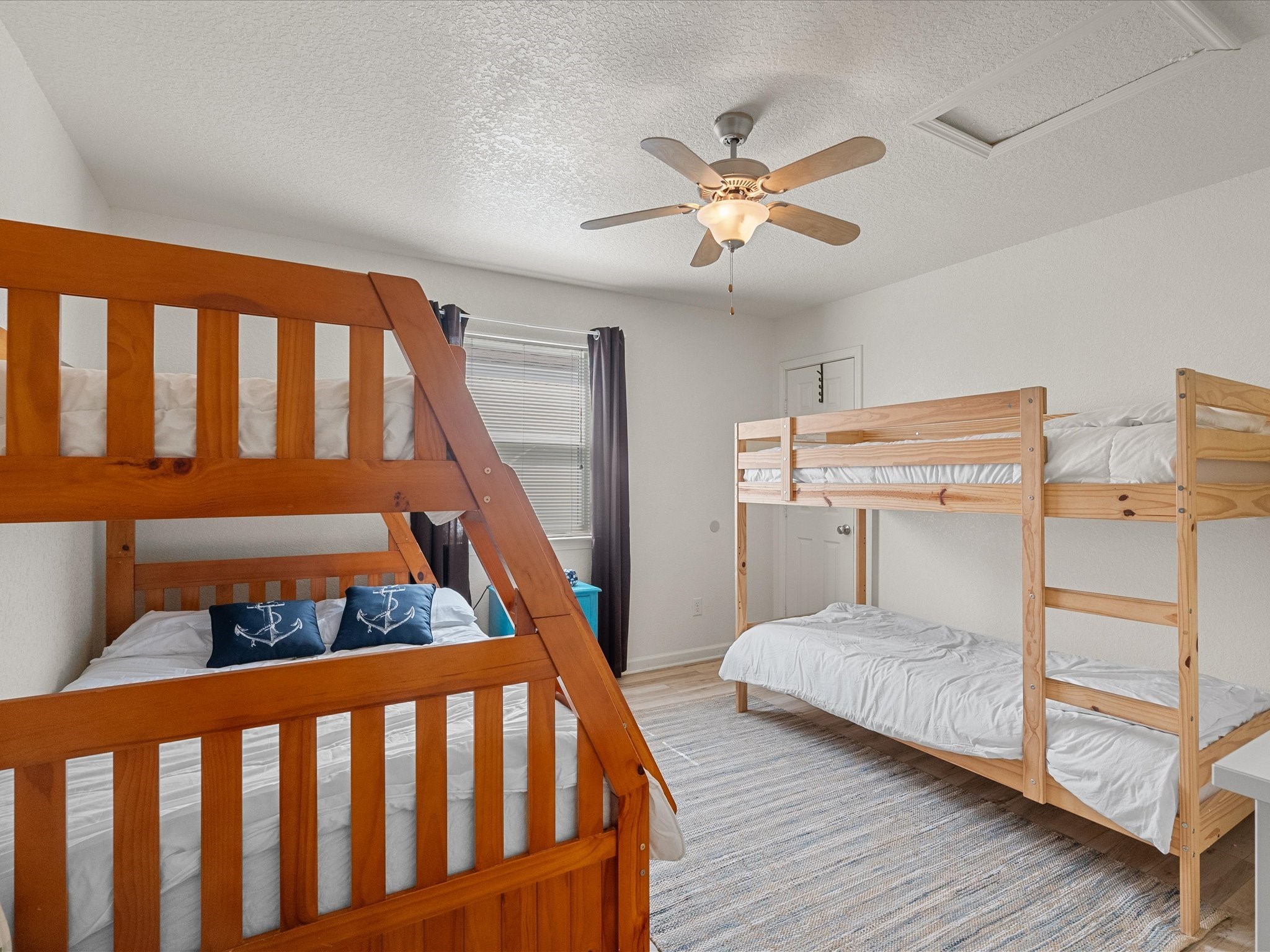 127 Howard Avenue Surfside Beach, TX 77541 - Photo 19 of 29 a bedroom with furniture and a window