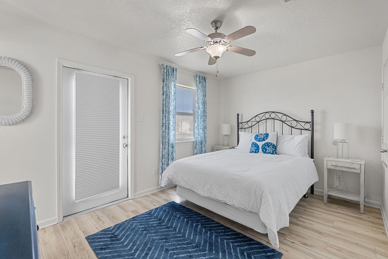 127 Howard Avenue Surfside Beach, TX 77541 - Photo 22 of 29 a bedroom with a bed and window