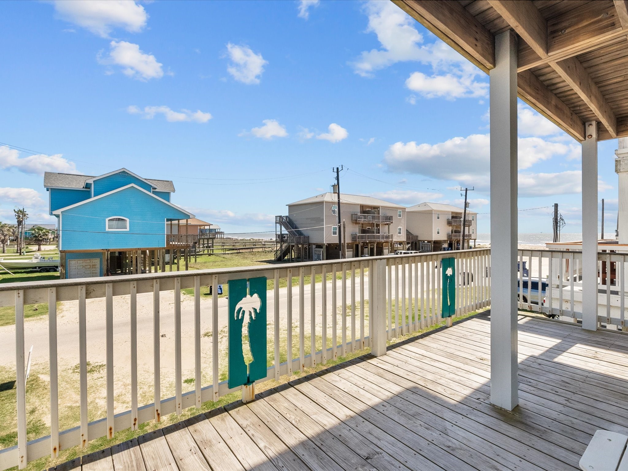 127 Howard Avenue Surfside Beach, TX 77541 - Photo 26 of 29 a view of balcony with wooden floor