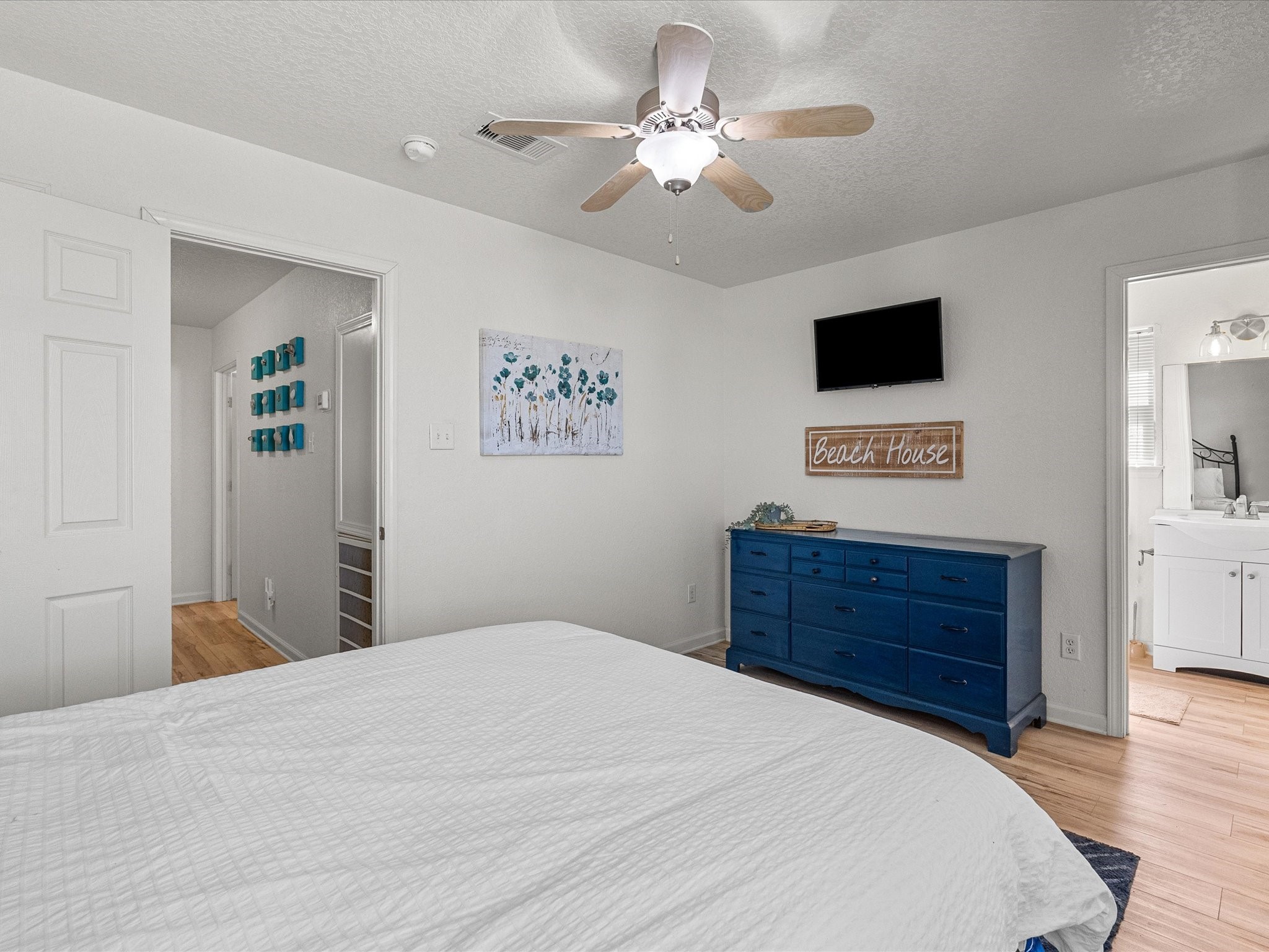 127 Howard Avenue Surfside Beach, TX 77541 - Photo 27 of 29 a bedroom with a bed cabinets and a window