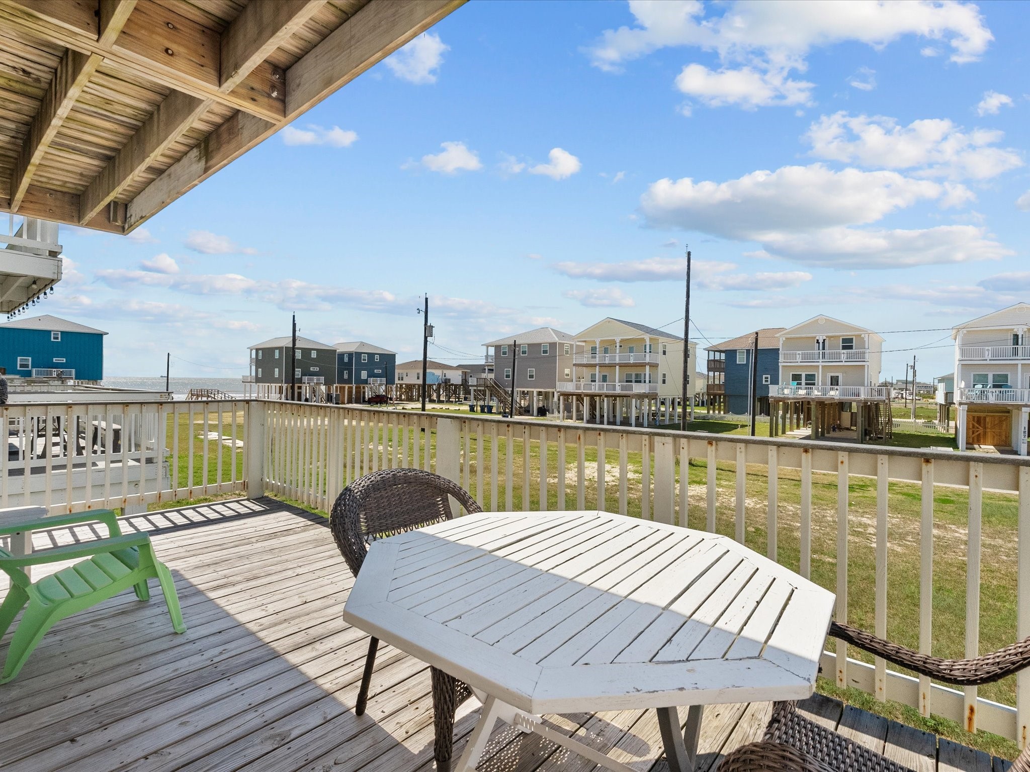 127 Howard Avenue Surfside Beach, TX 77541 - Photo 28 of 29 a lake view with a chair under an umbrella