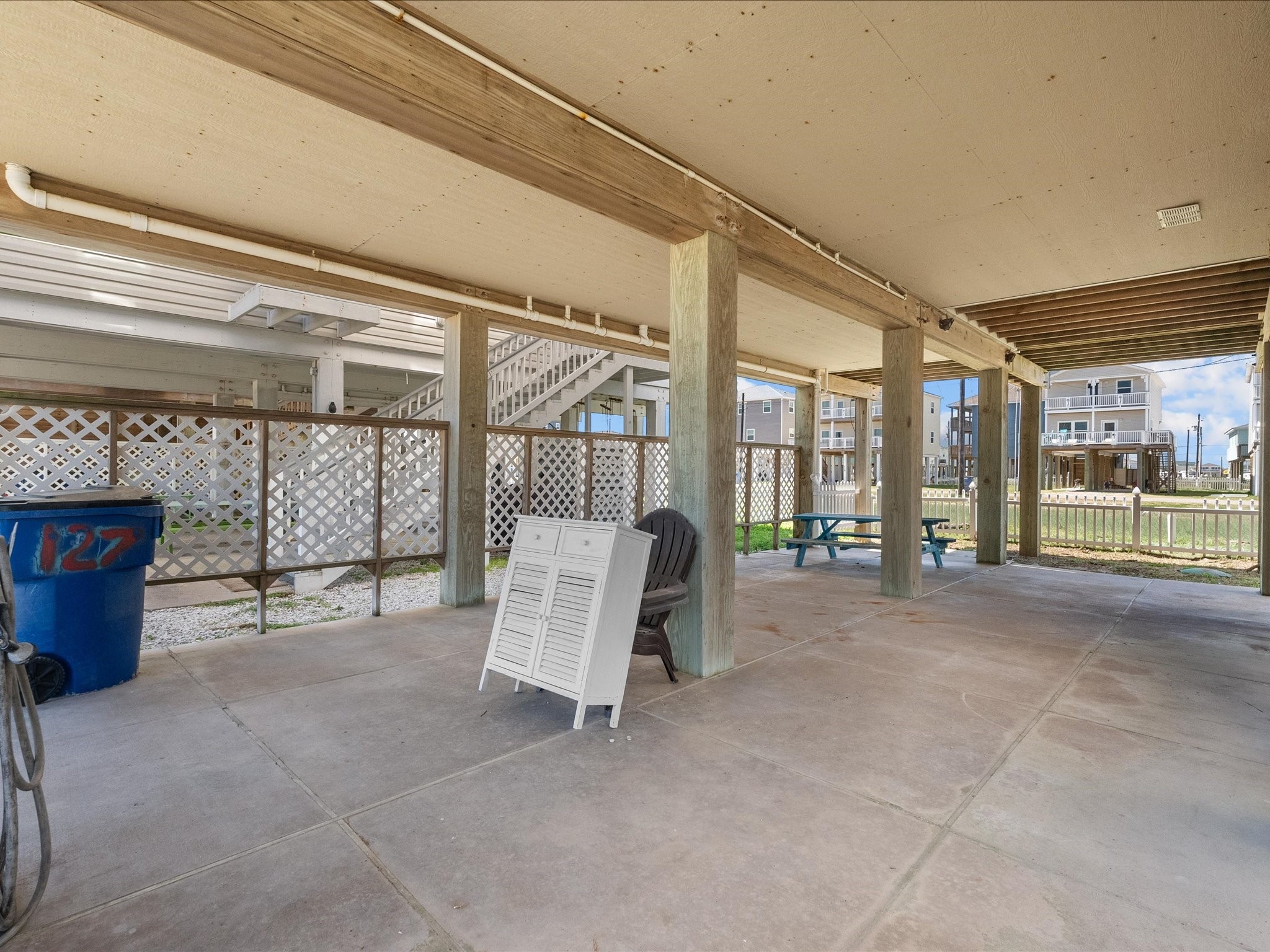 127 Howard Avenue Surfside Beach, TX 77541 - Photo 29 of 29 a bed room with a bed and glass door
