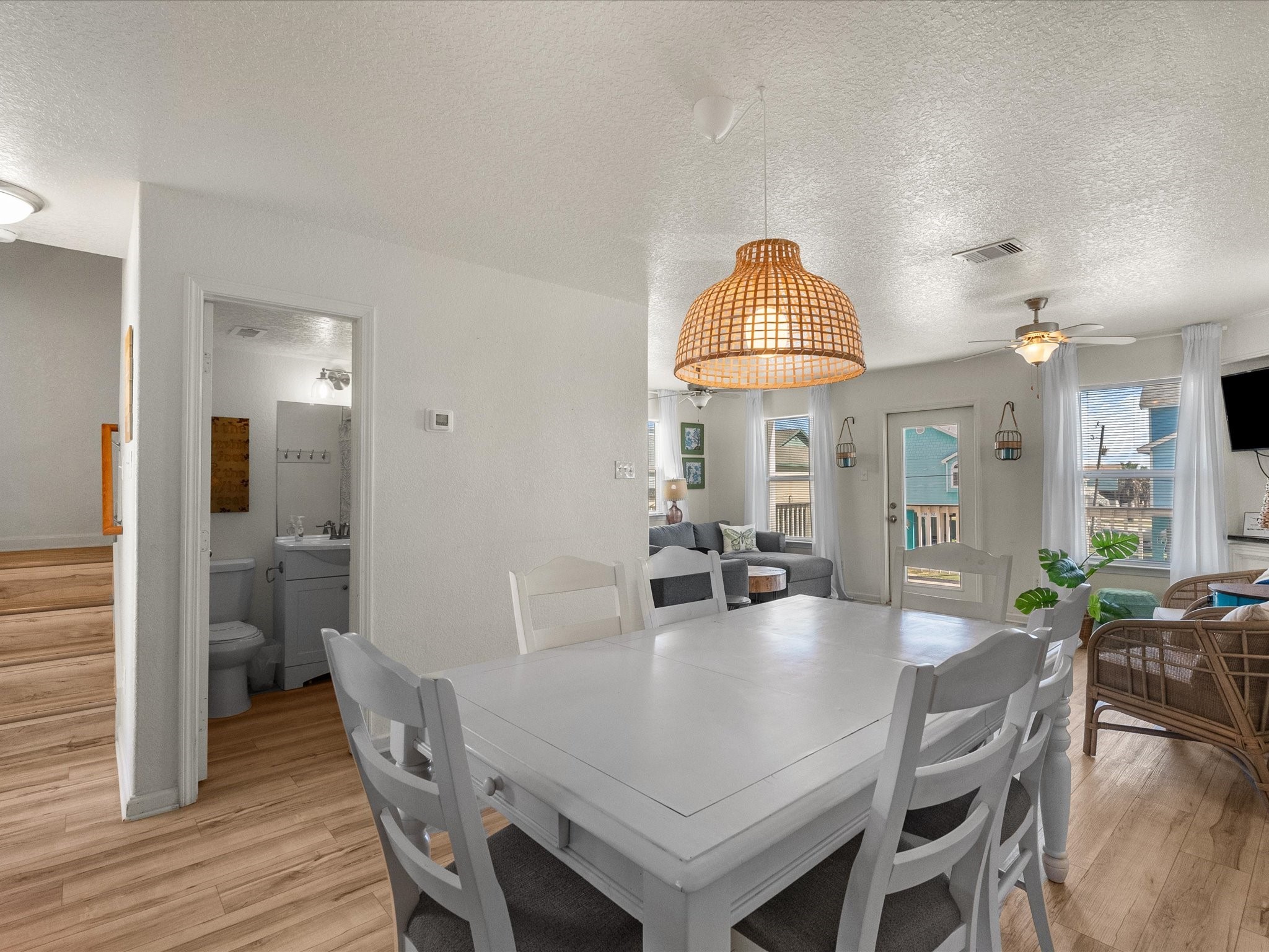 127 Howard Avenue Surfside Beach, TX 77541 - Photo 8 of 29 a view of a a dining room with furniture window and wooden floor