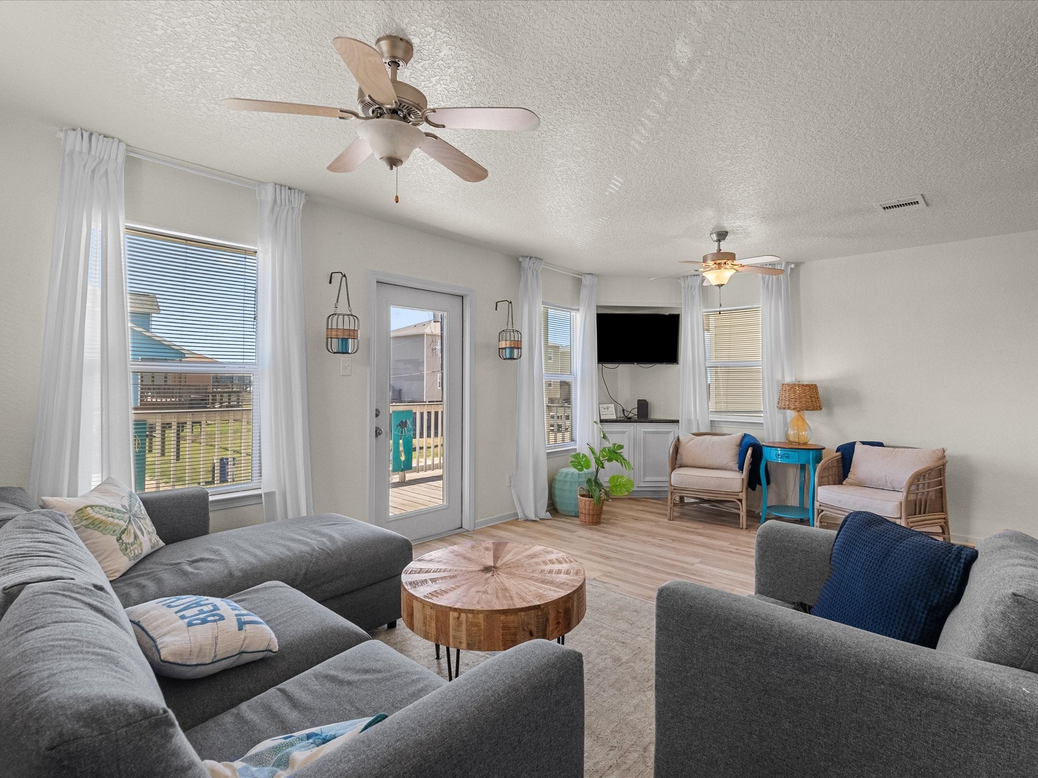 127 Howard Avenue Surfside Beach, TX 77541 - Photo 10 of 29 a living room with furniture and a flat screen tv