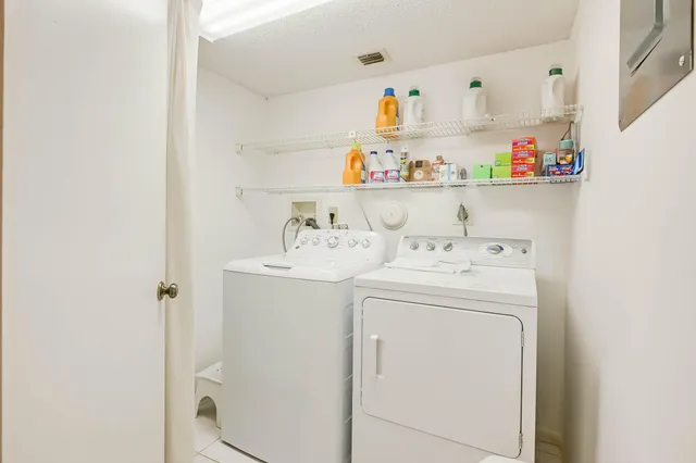 a bathroom with a granite countertop sink mirror bathtub and shower