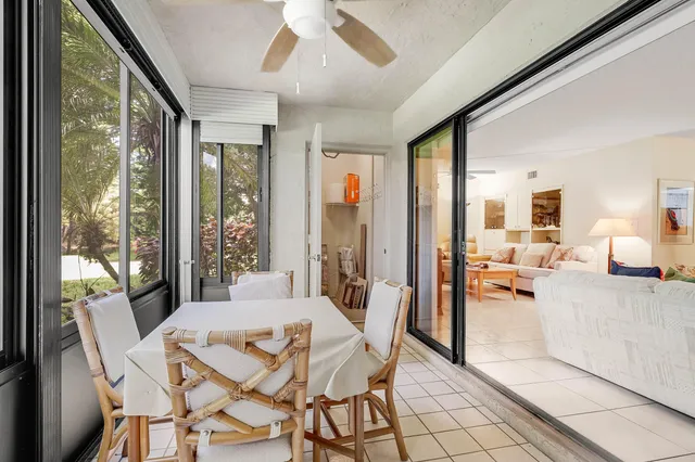 an aerial view of a house with a garden and lake view