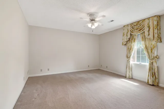 a view of a livingroom with furniture wooden floor and a fireplace