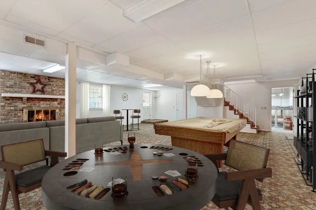 a view of an empty room with a fireplace