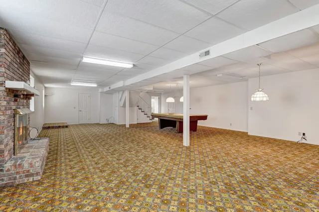 a view of a livingroom with furniture and a livingroom with furniture