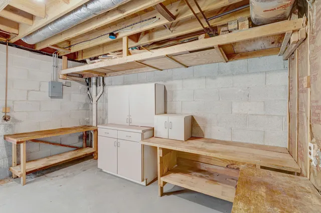 a picture of a room with a white wall and white cabinet