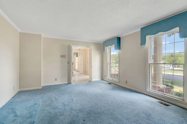 a view of an empty room with a glass door