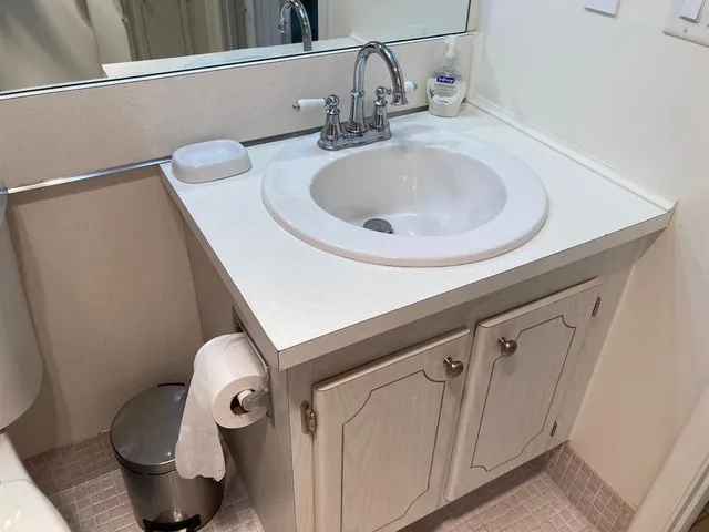 a bathroom with a toilet and shower