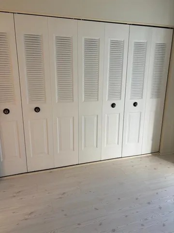 a view of a hallway with a chandelier