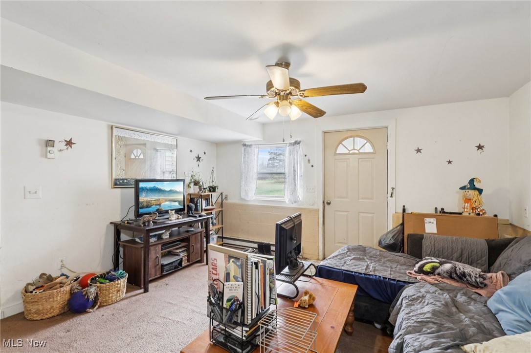 6370 Trumbull Road Geneva, OH 44041 - Photo 29 of 50 Living room with carpet and ceiling fan
