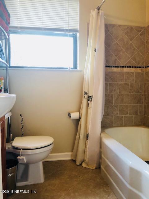 2419 Randy Road Jacksonville, FL 32216 - Photo 12 of 13 a bathroom with a toilet and a bathtub