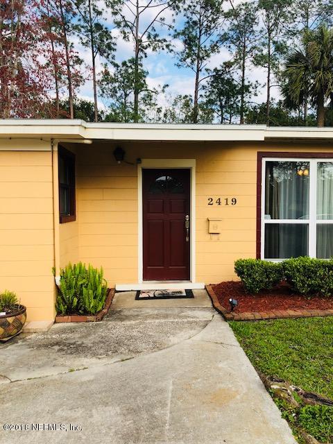 2419 Randy Road Jacksonville, FL 32216 - Photo 4 of 13 a front view of a house with a garden