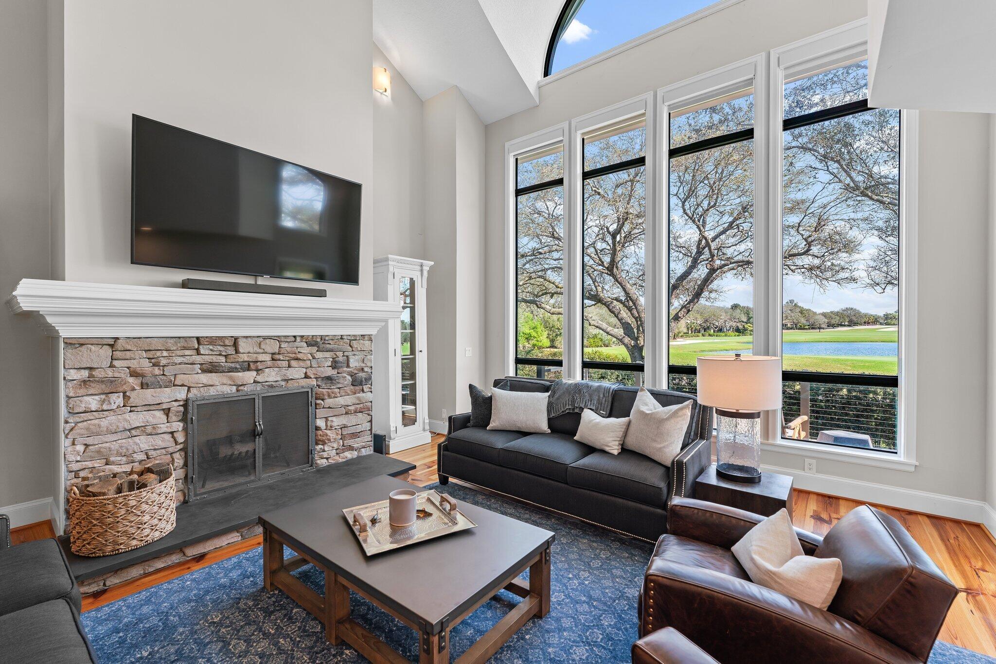 18760 Southeast Pineneedle Lane Jupiter, FL 33469 - Photo 11 of 58 a living room with furniture fireplace and flat screen tv