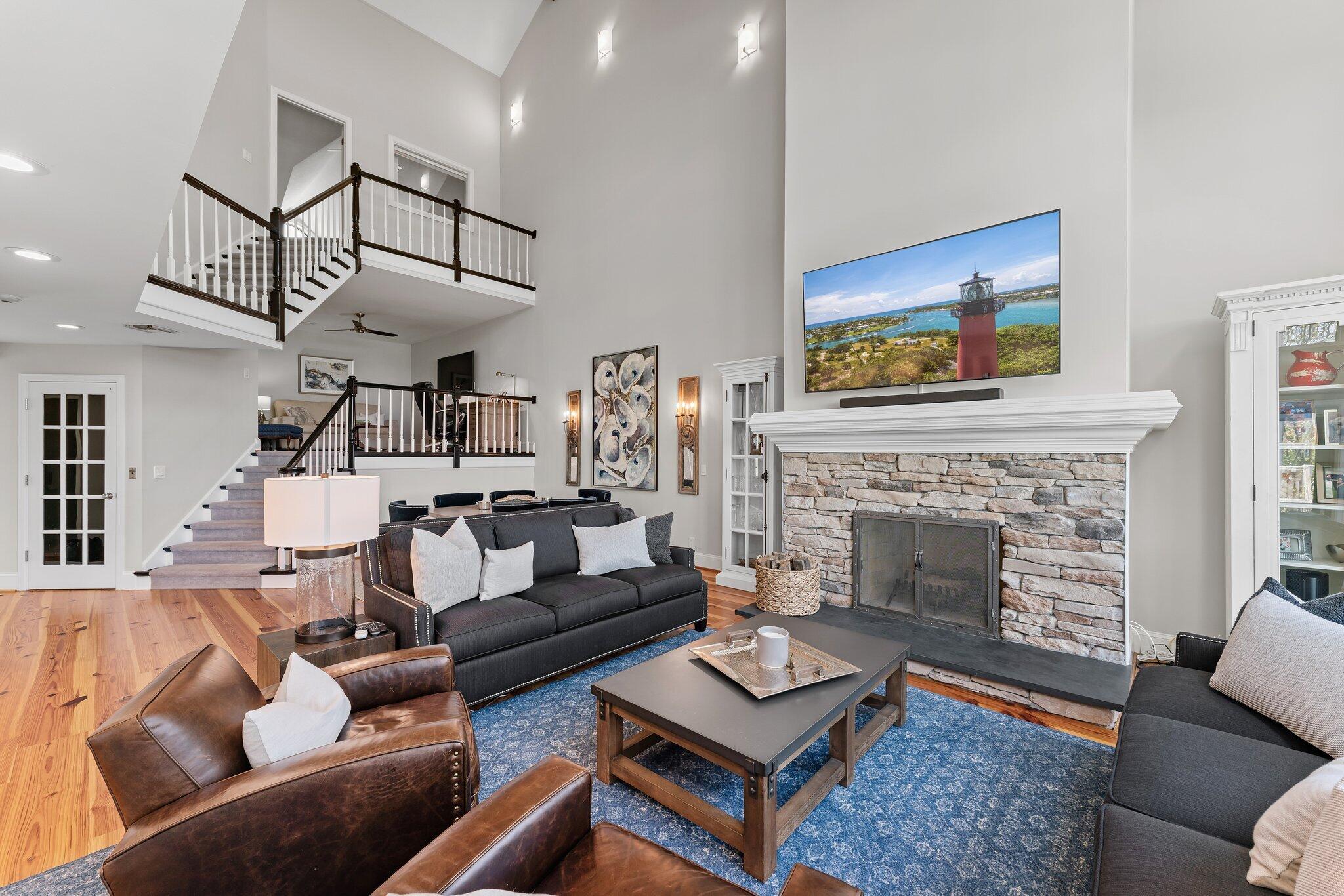 18760 Southeast Pineneedle Lane Jupiter, FL 33469 - Photo 16 of 58 a living room with furniture and a fireplace