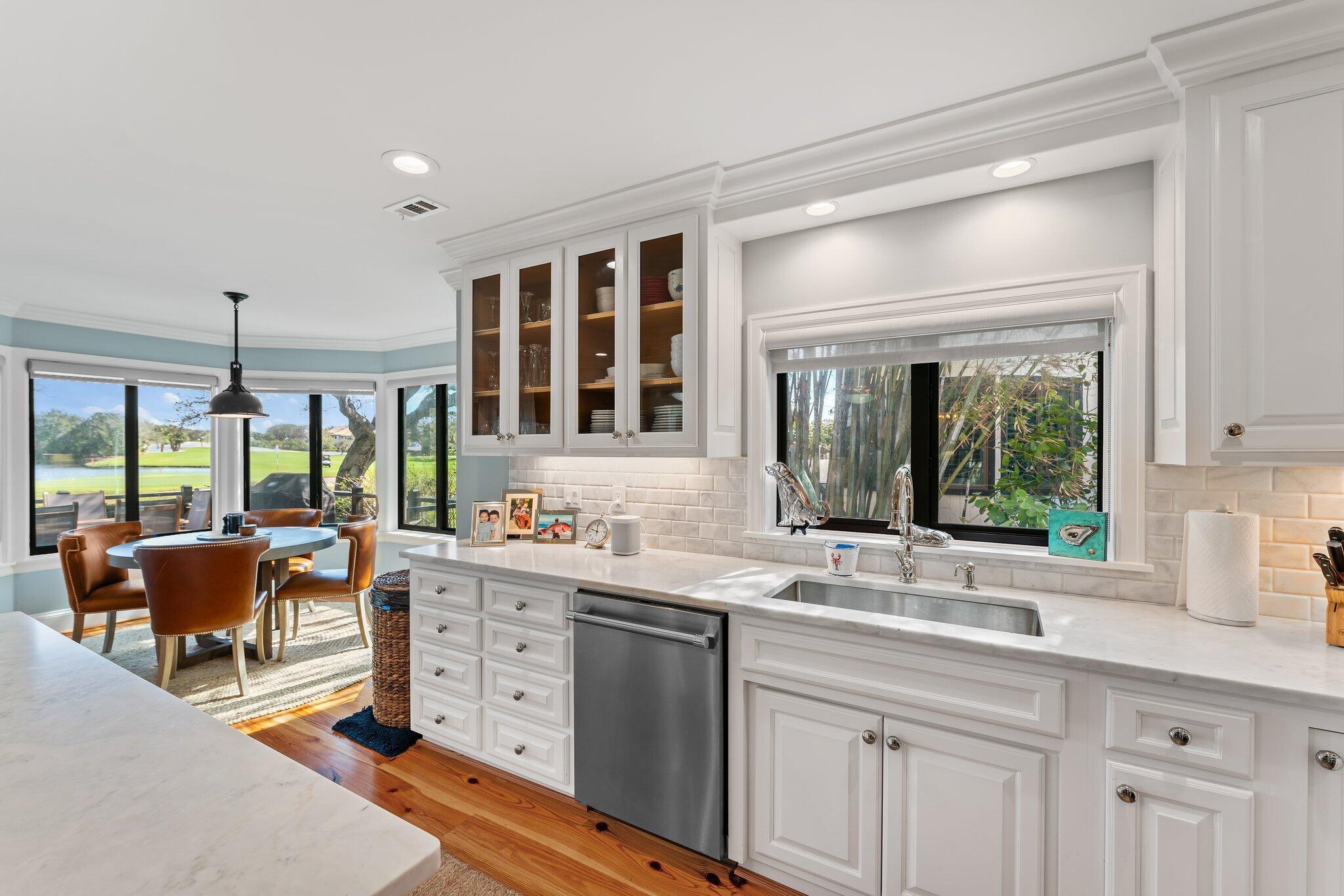 18760 Southeast Pineneedle Lane Jupiter, FL 33469 - Photo 24 of 58 a kitchen with a sink and large window