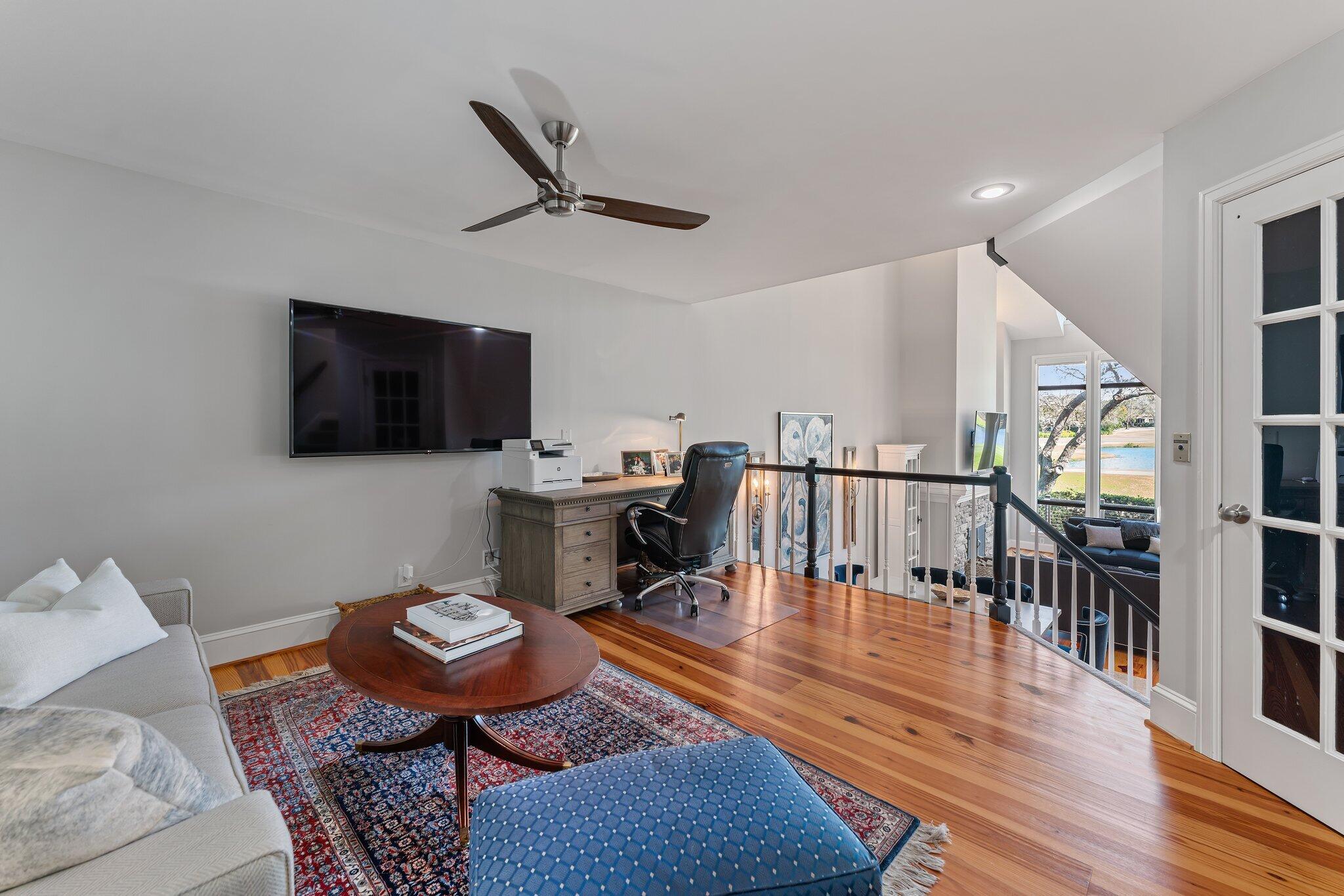 18760 Southeast Pineneedle Lane Jupiter, FL 33469 - Photo 28 of 58 a living room with furniture and a flat screen tv
