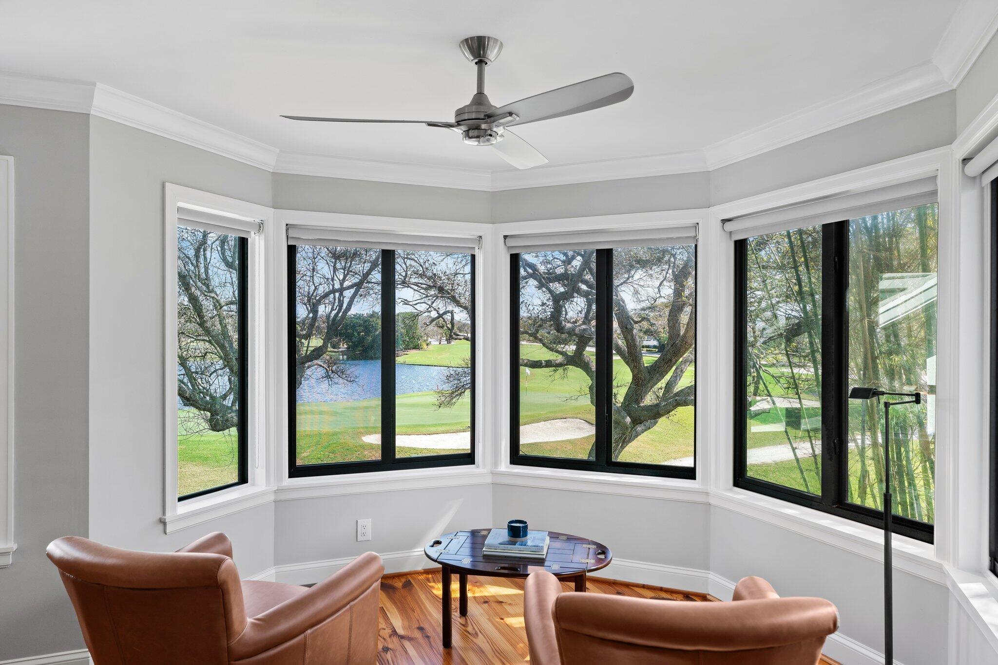 18760 Southeast Pineneedle Lane Jupiter, FL 33469 - Photo 32 of 58 a living room with furniture and a large window