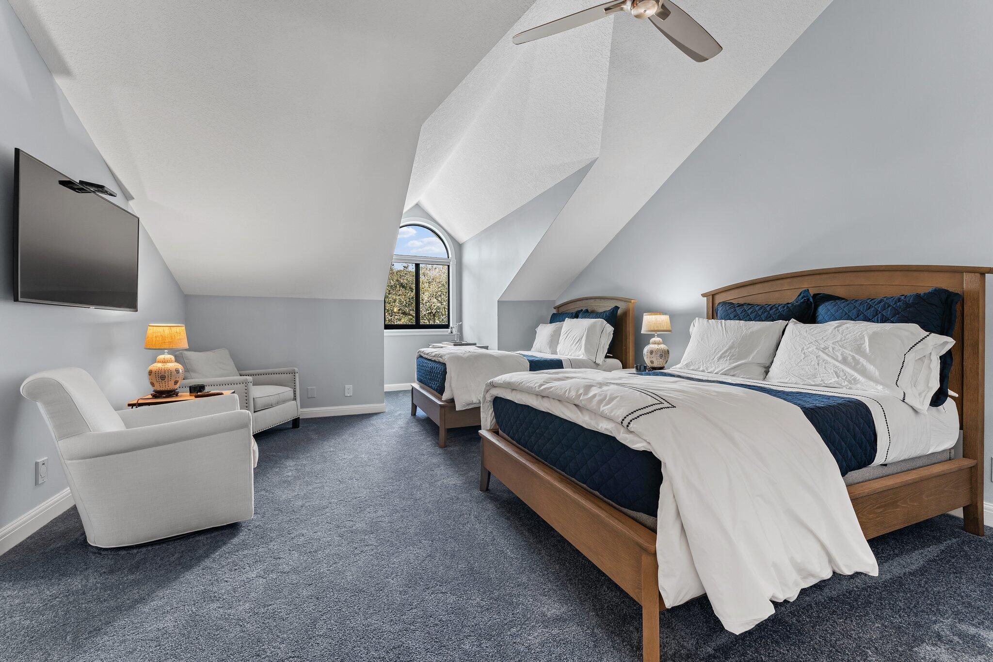 18760 Southeast Pineneedle Lane Jupiter, FL 33469 - Photo 39 of 58 a bedroom with a bed and a flat screen tv