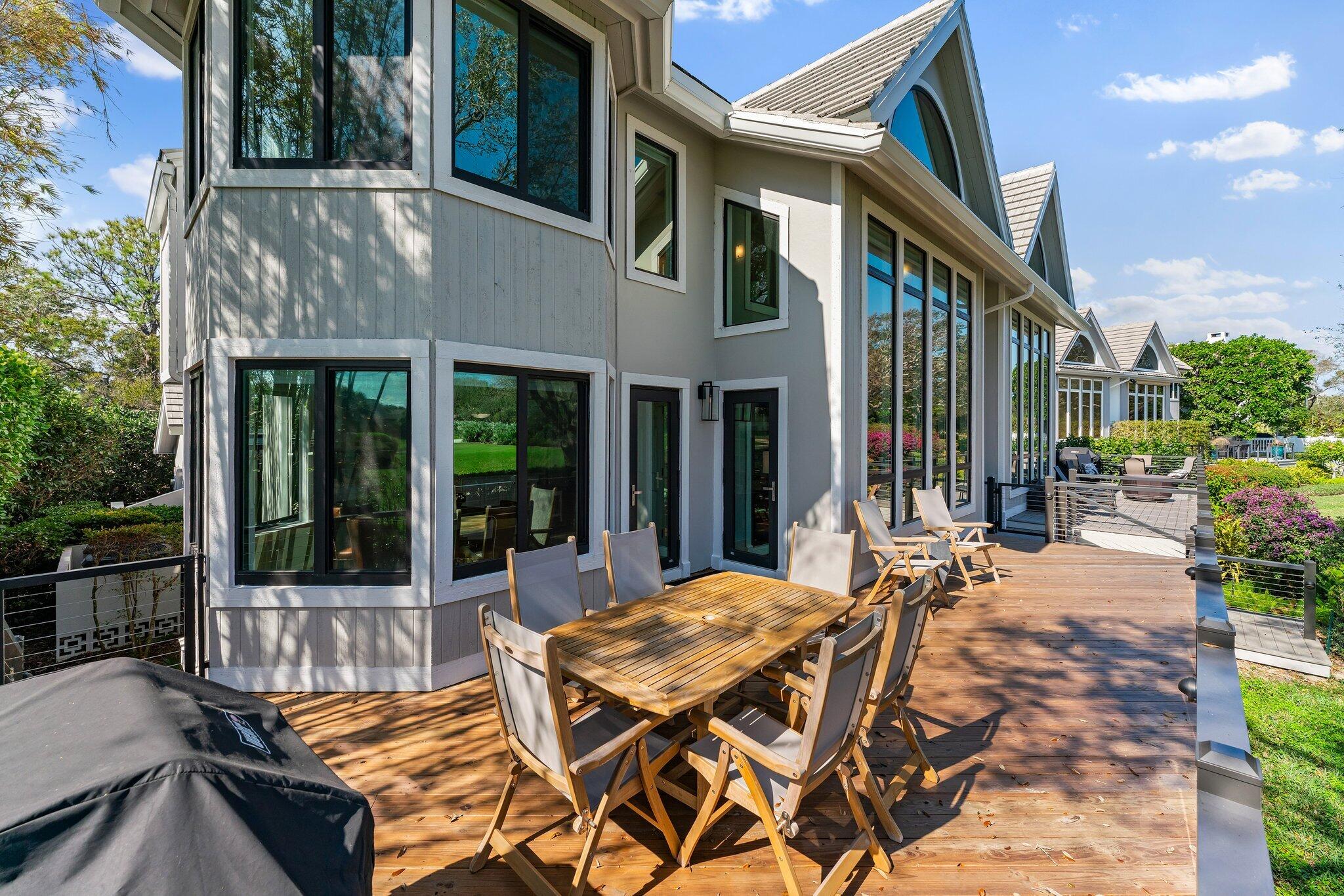 18760 Southeast Pineneedle Lane Jupiter, FL 33469 - Photo 49 of 58 a view of outdoor space yard deck patio and swimming pool