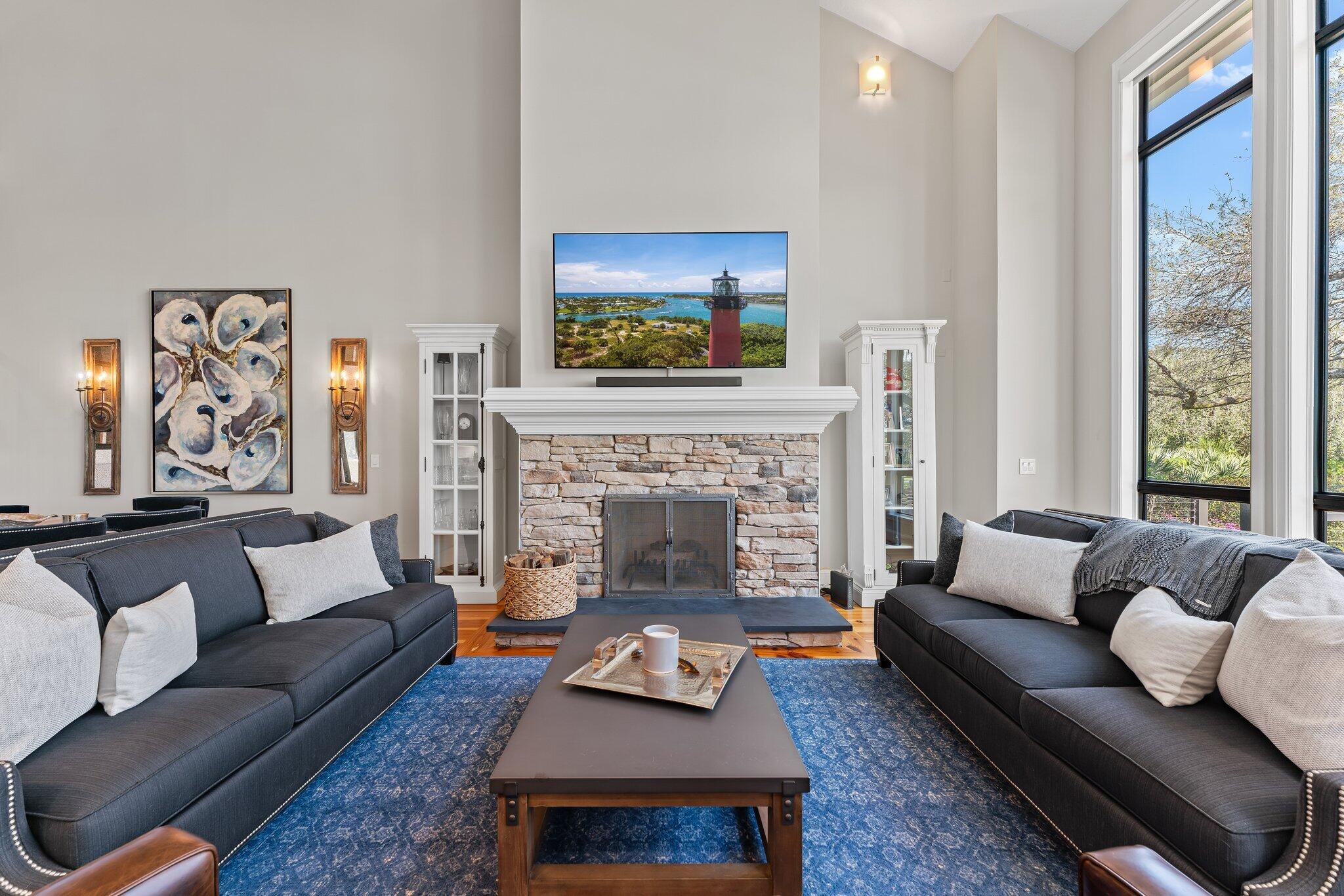 18760 Southeast Pineneedle Lane Jupiter, FL 33469 - Photo 10 of 58 a living room with furniture and a fireplace