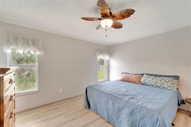 a bedroom with a large bed and a window