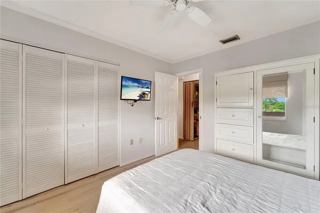 a bedroom with a bed and a closet