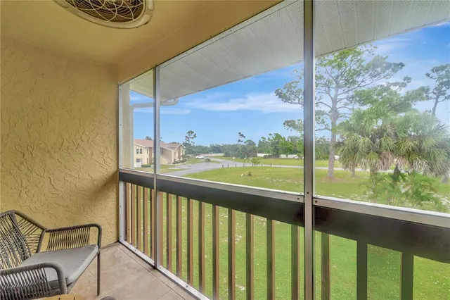 a view of a balcony with chairs