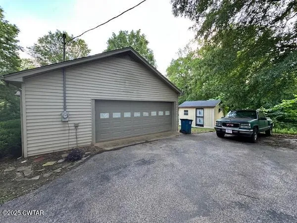 a view of a house with a garage