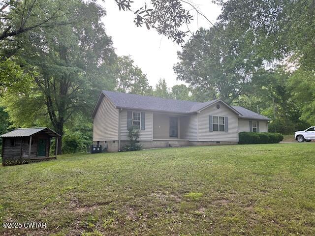 780 Hickory Flat Road Cedar Grove, TN 38321 - Photo 17 of 17 a large house with a big yard and large tree