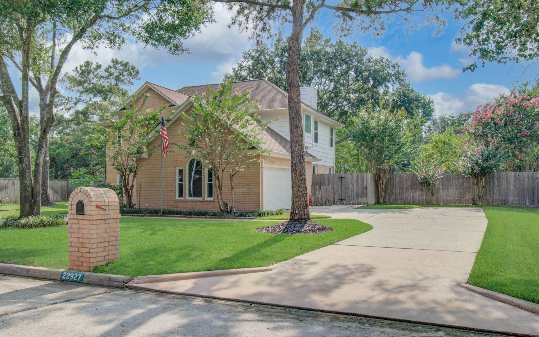 22927 Northoak Forest Lane Spring, TX 77389 - Photo 30 of 37 a front view of a house with a yard and garage