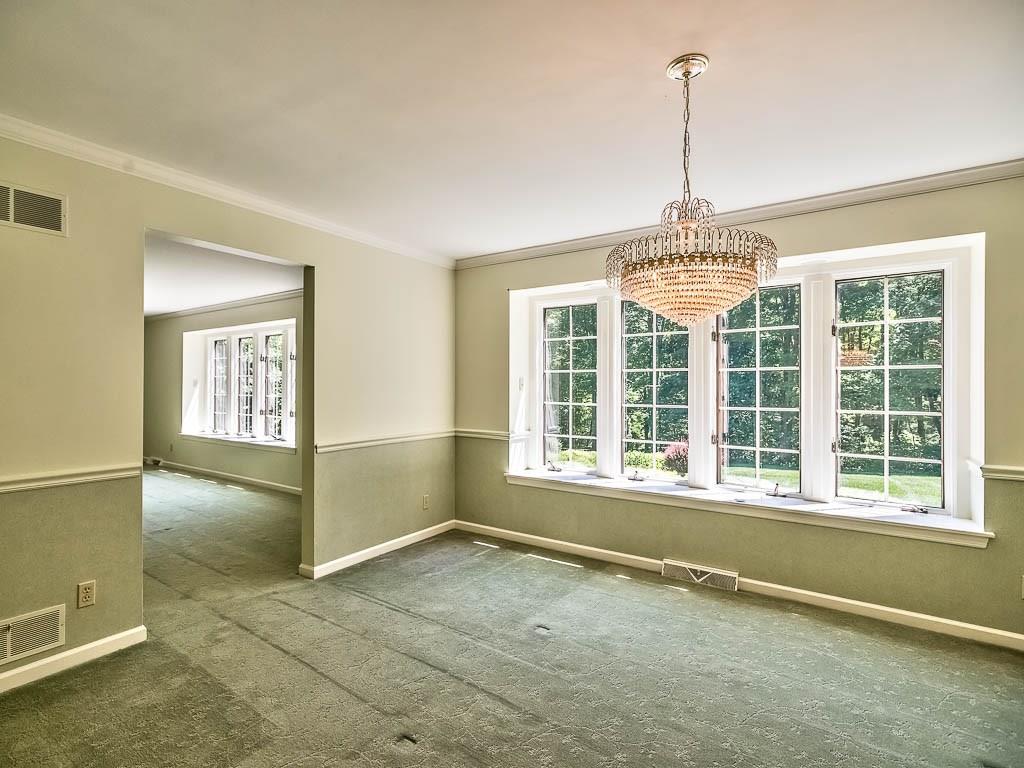 558 Callery Road Cranberry Township, PA 16066 - Photo 6 of 25 The Dining Room also features a Large Bay Window. Notice the Crown Molding and Chair Rail Detail