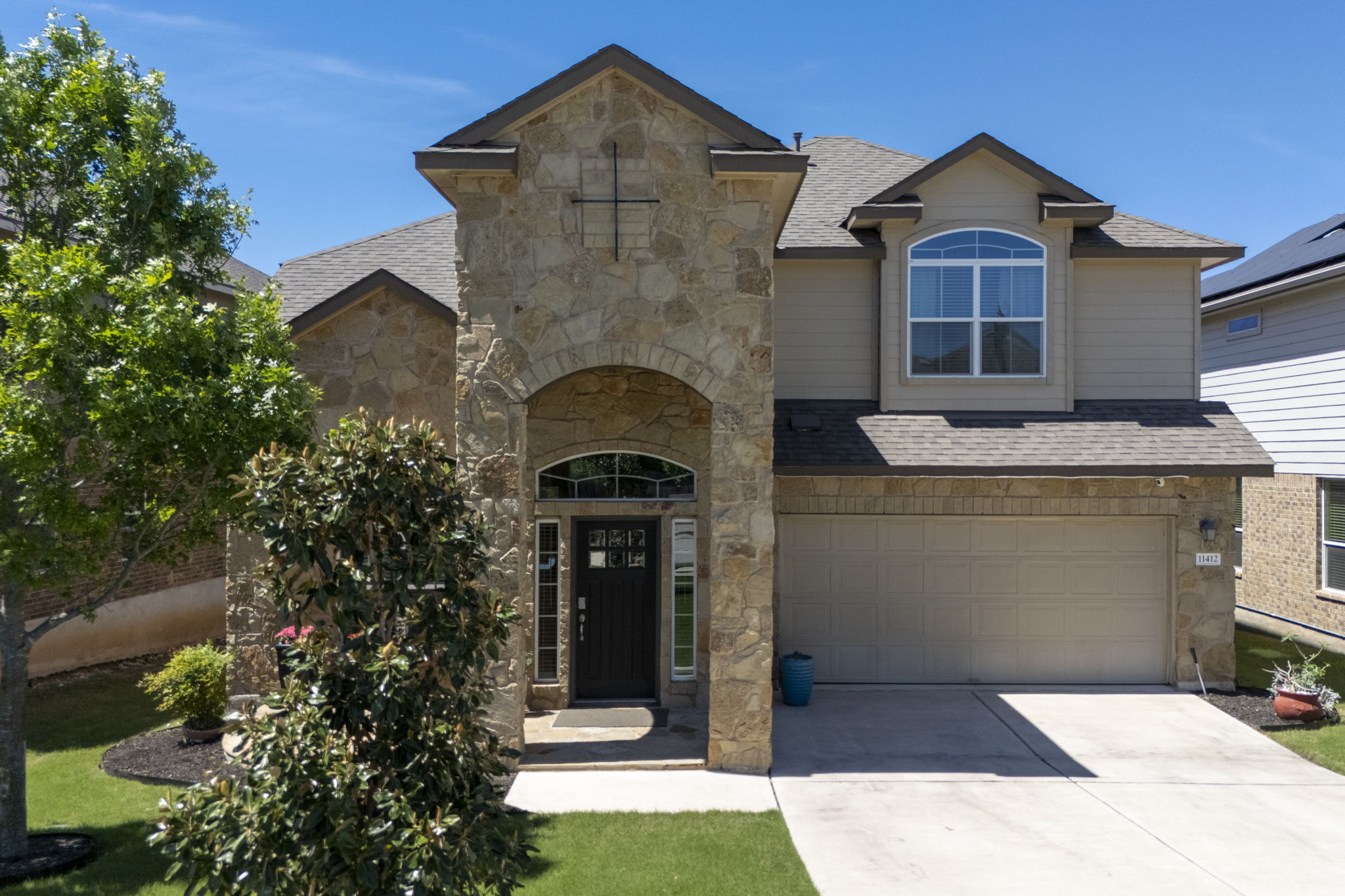 11412 Reading Way Austin, TX 78717 - Photo 4 of 35 a front view of a house with a yard