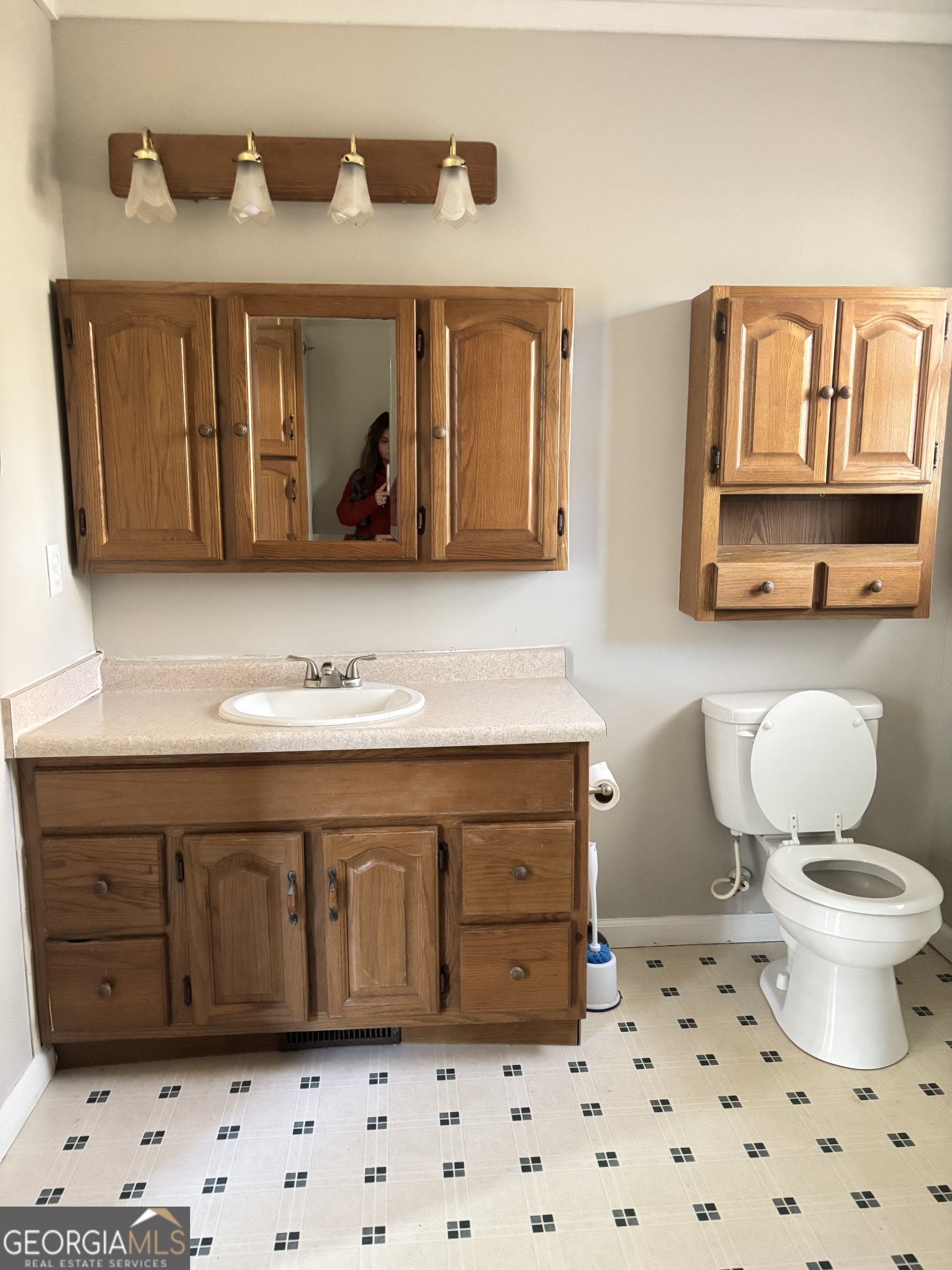 358 Whippoorwill Road Monticello, GA 31064 - Photo 16 of 20 a bathroom with a sink a toilet and a mirror