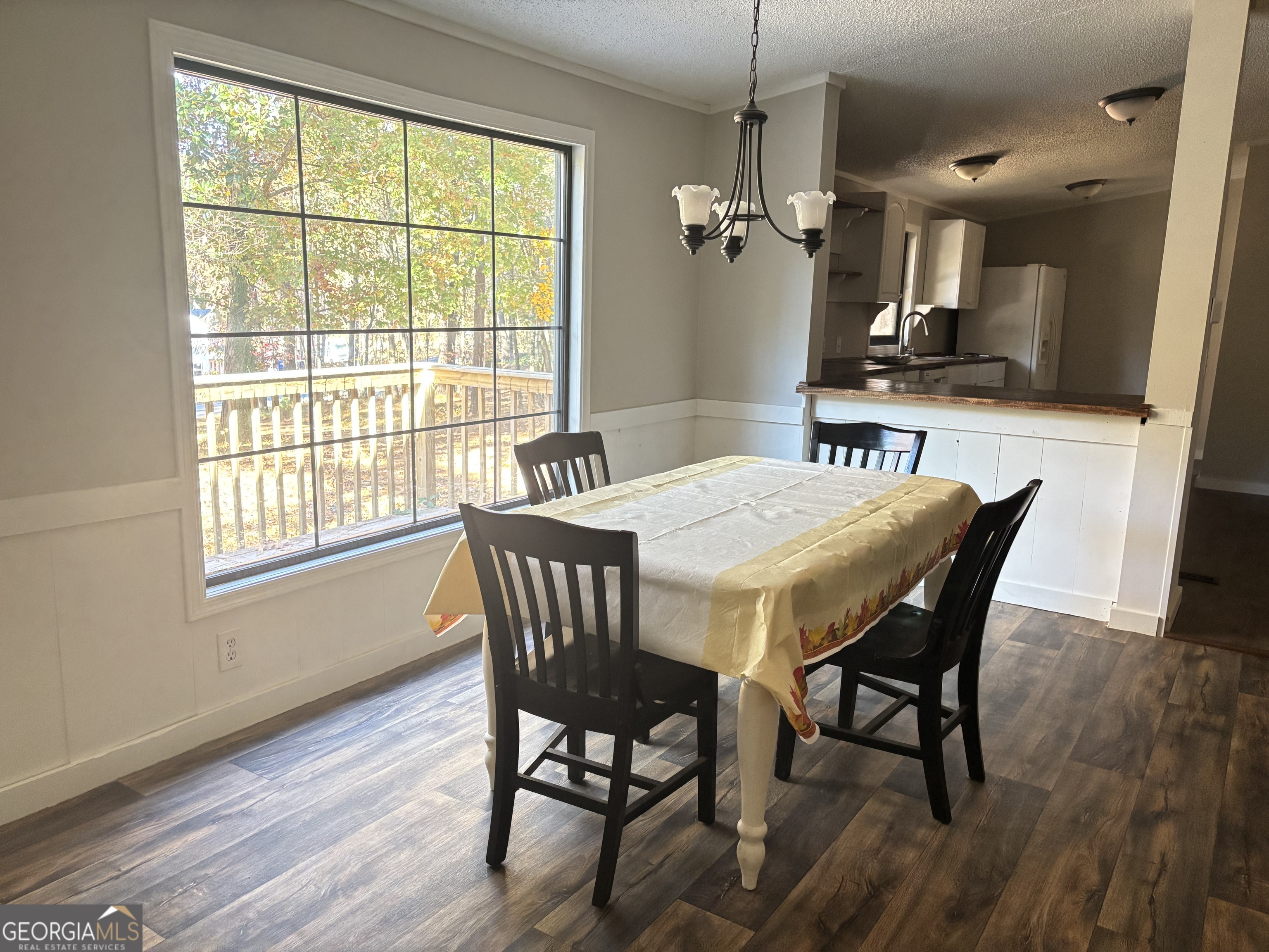 358 Whippoorwill Road Monticello, GA 31064 - Photo 8 of 20 a view of a dining room with furniture window and wooden floor