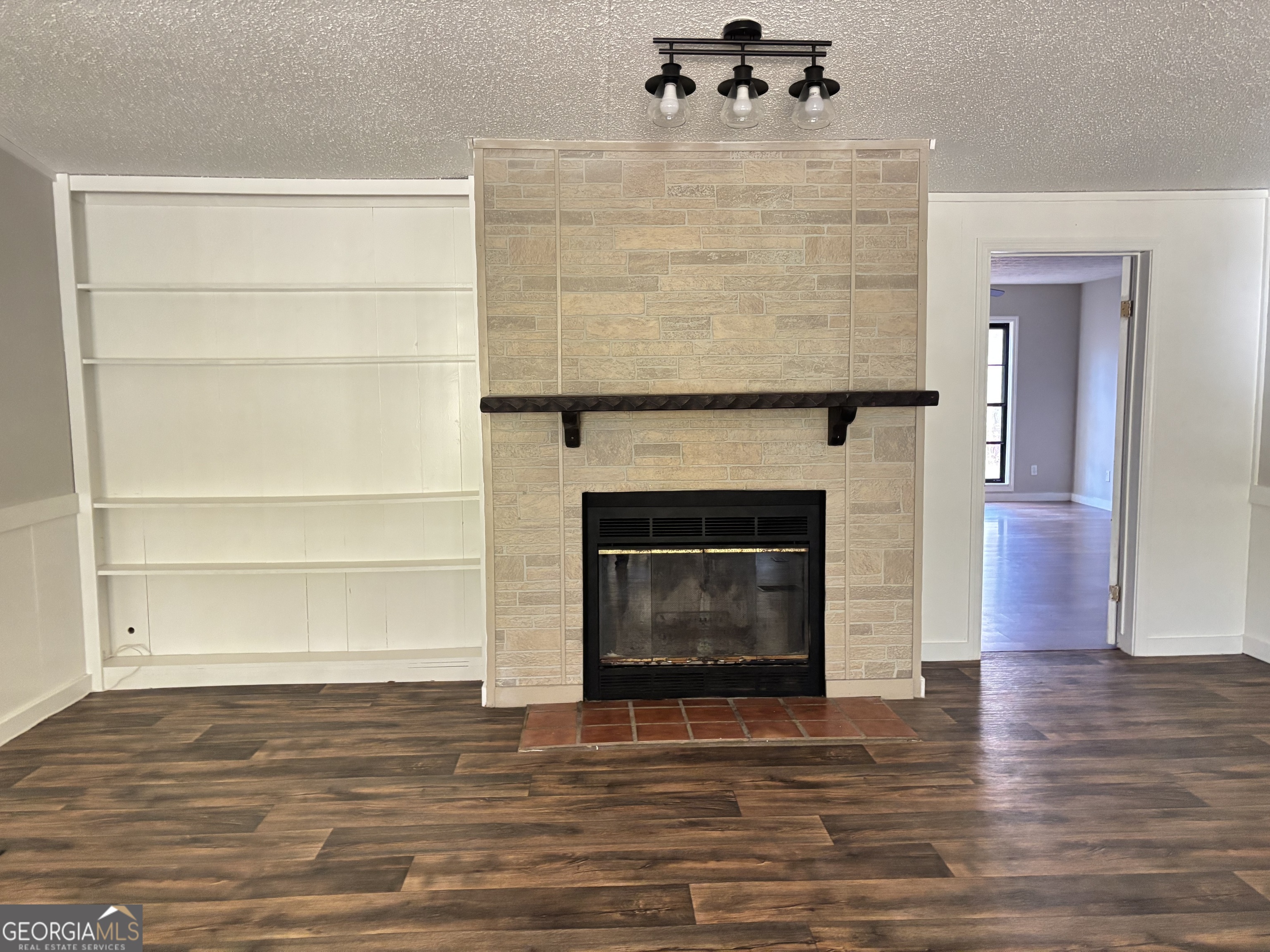 358 Whippoorwill Road Monticello, GA 31064 - Photo 10 of 20 a living room with a fireplace