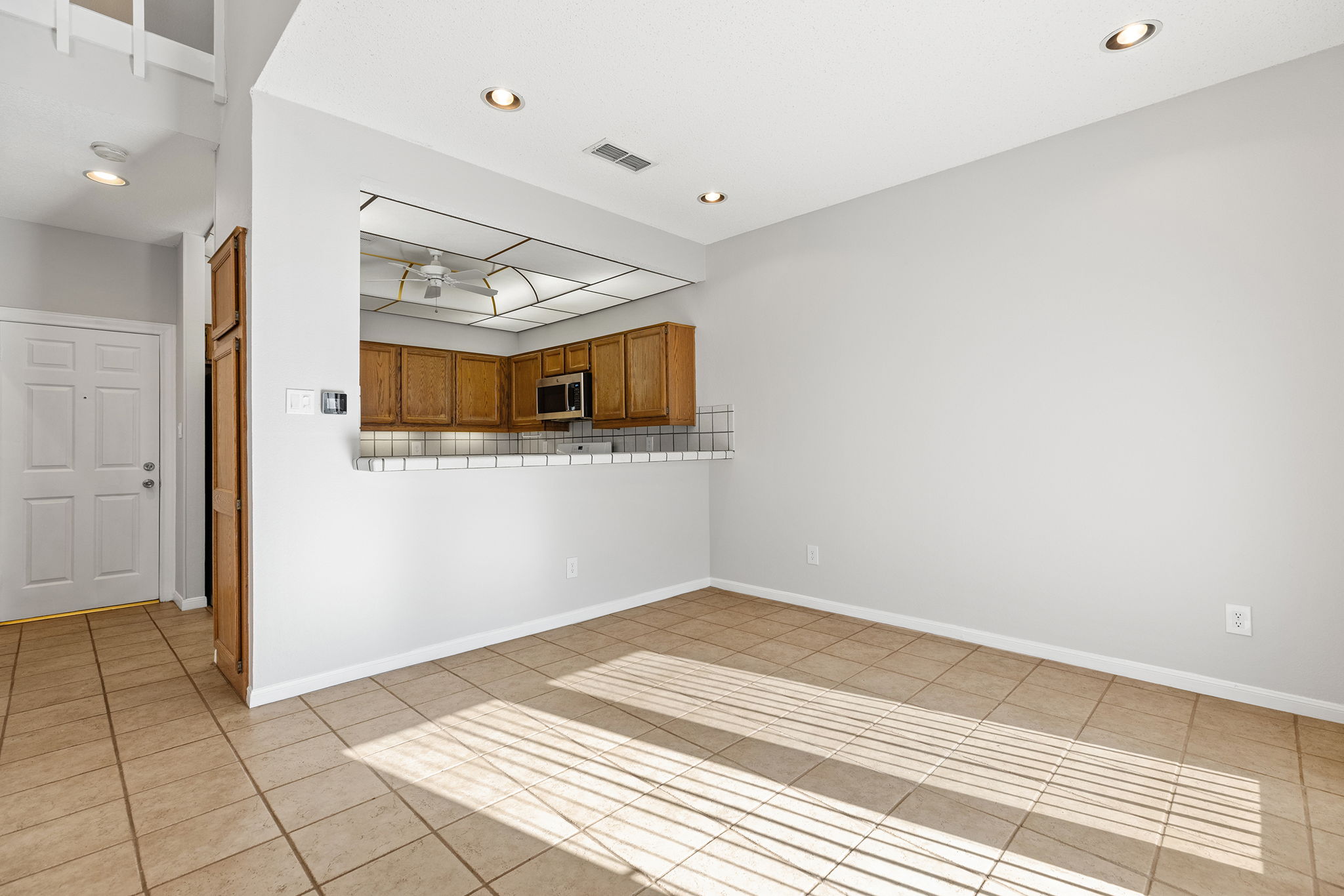 10819 Crown Colony Drive, Unit 11 Austin, TX 78747 - Photo 12 of 40 Sightlines stay open, ceilings stay high, and movement between spaces feels effortless.
