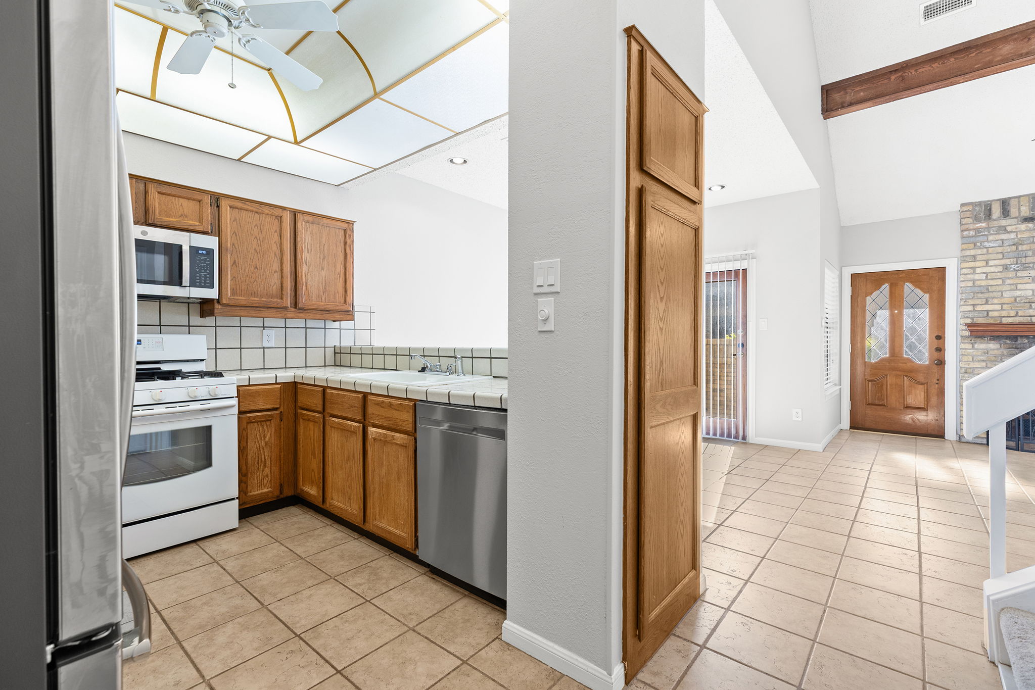 10819 Crown Colony Drive, Unit 11 Austin, TX 78747 - Photo 15 of 40 The kitchen feels comfortably tucked in yet completely connected to the rest of the home.