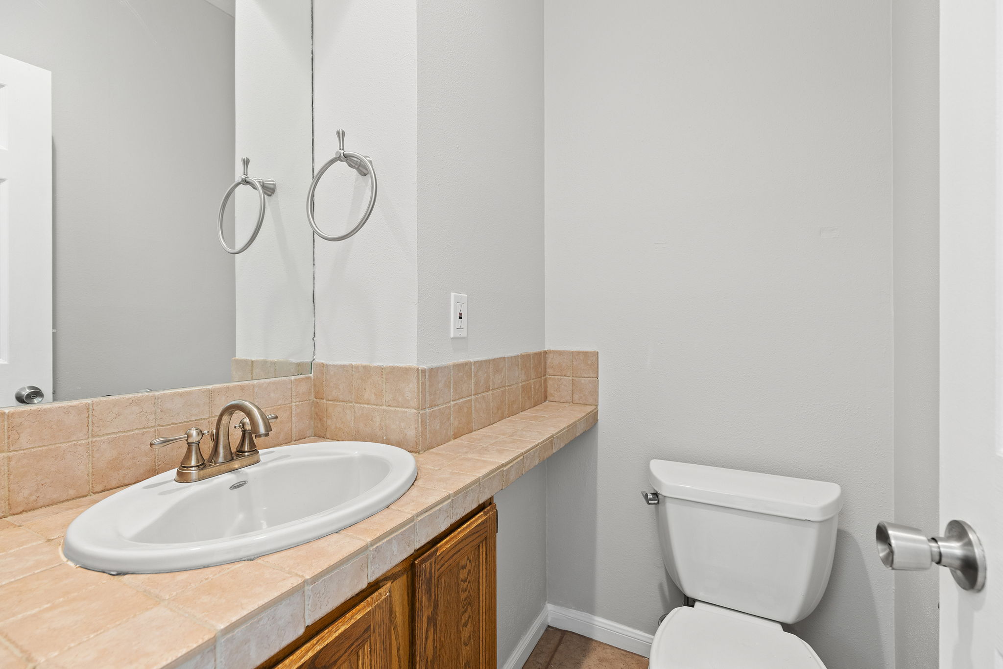 10819 Crown Colony Drive, Unit 11 Austin, TX 78747 - Photo 18 of 40 Conveniently located on the main level, the half bath adds everyday functionality for guests and daily use.