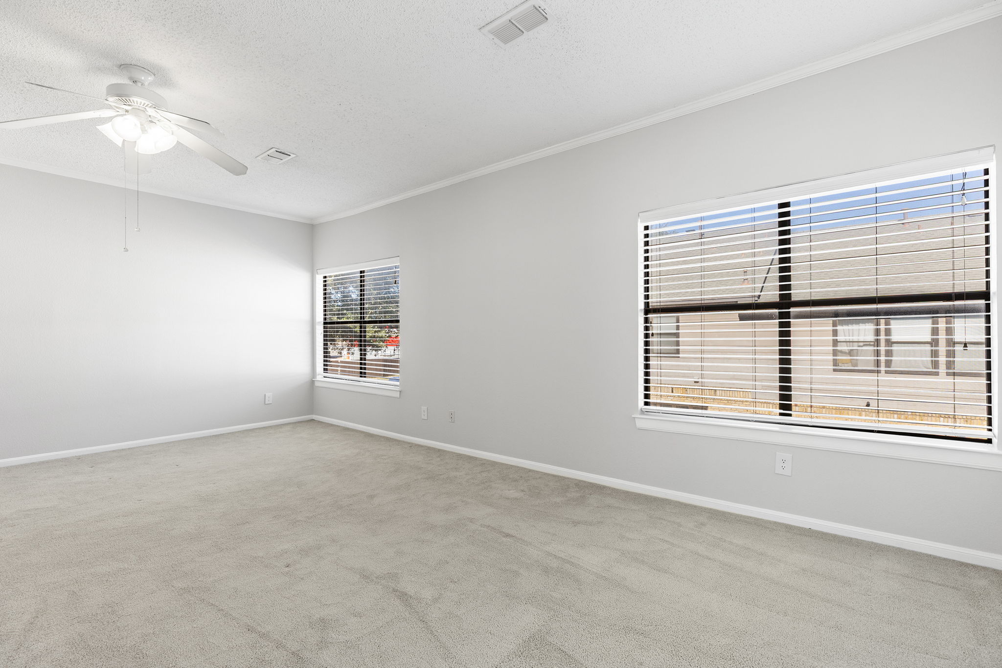 10819 Crown Colony Drive, Unit 11 Austin, TX 78747 - Photo 21 of 40 There’s room here to breathe, to stretch out, and to arrange the space exactly how you want it (bed, seating, workspace) without feeling crowded.