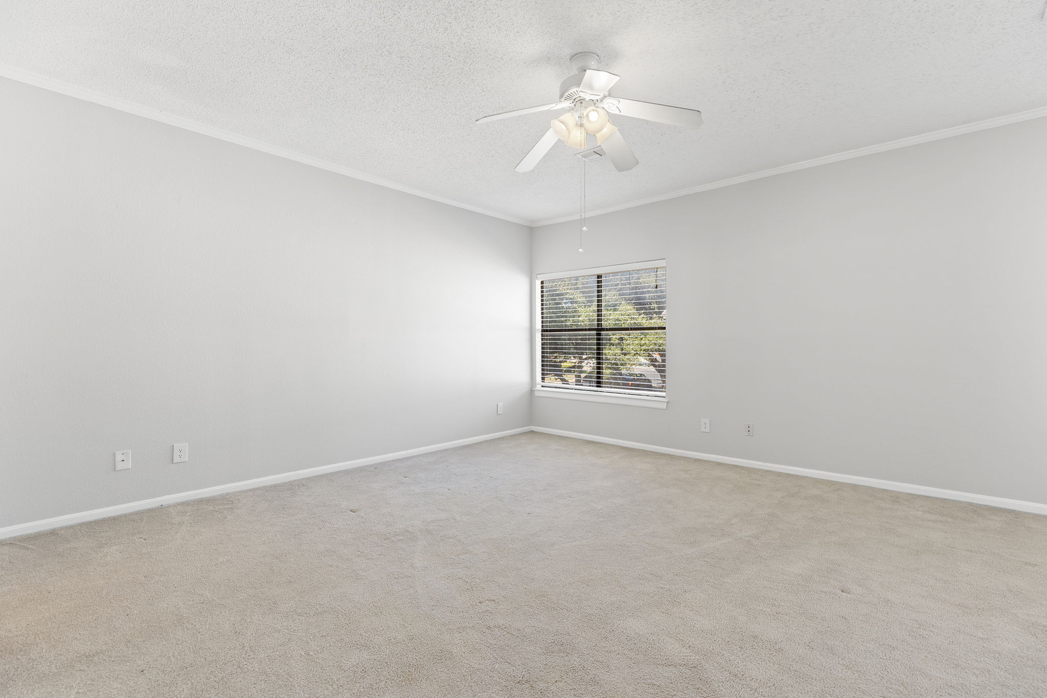 10819 Crown Colony Drive, Unit 11 Austin, TX 78747 - Photo 27 of 40 Whether it’s set up for everyday use or reserved for visitors, this room offers privacy and comfort without complication.