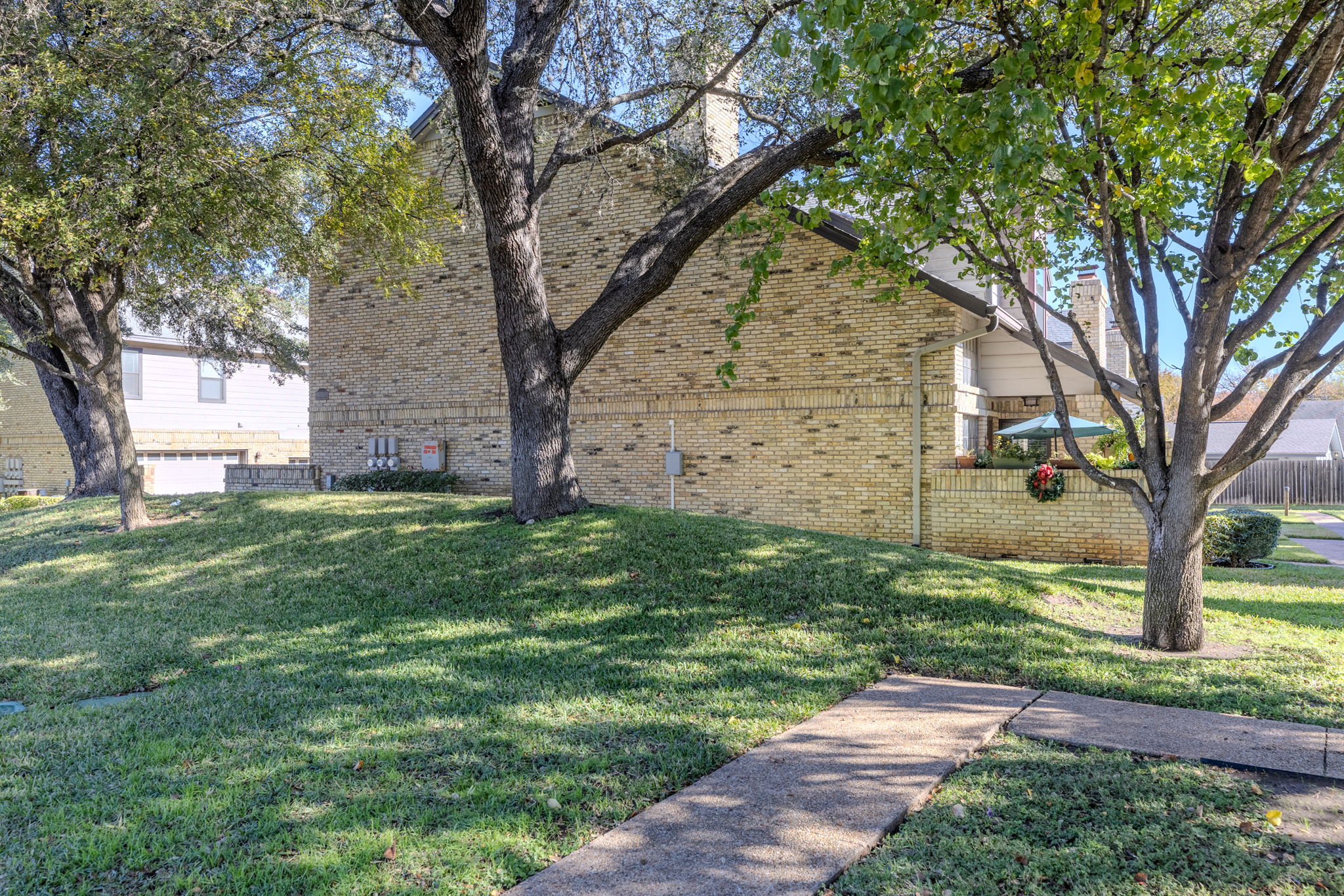 10819 Crown Colony Drive, Unit 11 Austin, TX 78747 - Photo 32 of 40 Mature trees stretch across the neighborhood, winding roads invite evening walks, and pockets of water and greenbelt views appear when you least expect them.