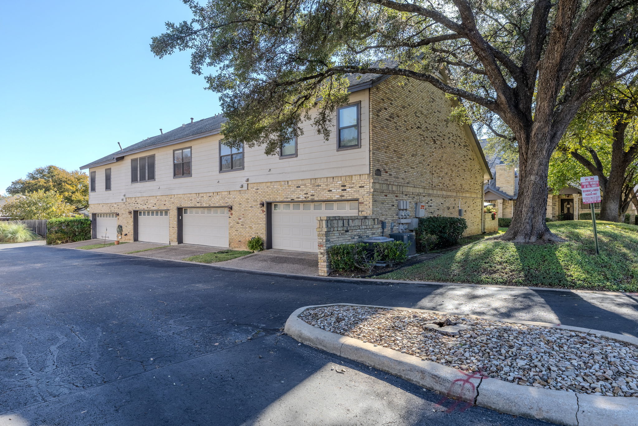 10819 Crown Colony Drive, Unit 11 Austin, TX 78747 - Photo 7 of 40 Tucked discreetly behind the home, the rear-entry garage keeps the streetscape clean and uncluttered, preserving the community’s charm.